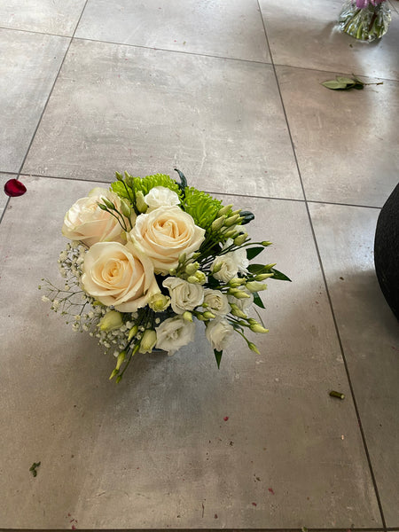 White and green arrangements in a vase
