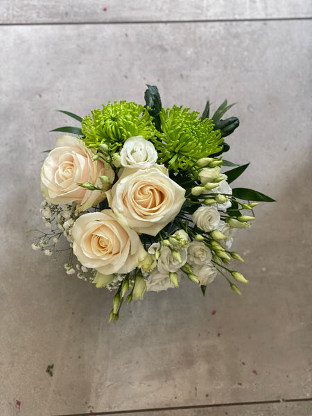 White and green arrangements in a vase