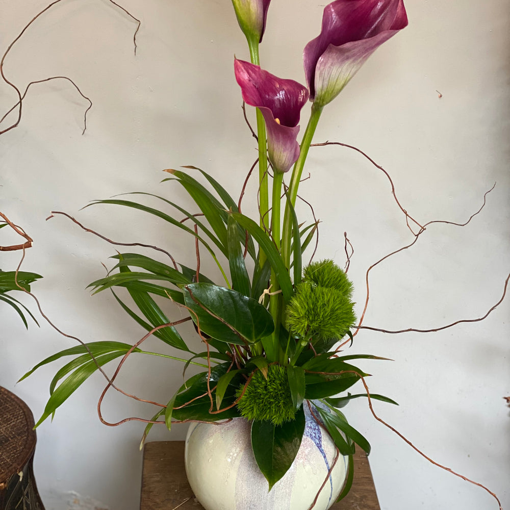 Calla and twigs arrangement