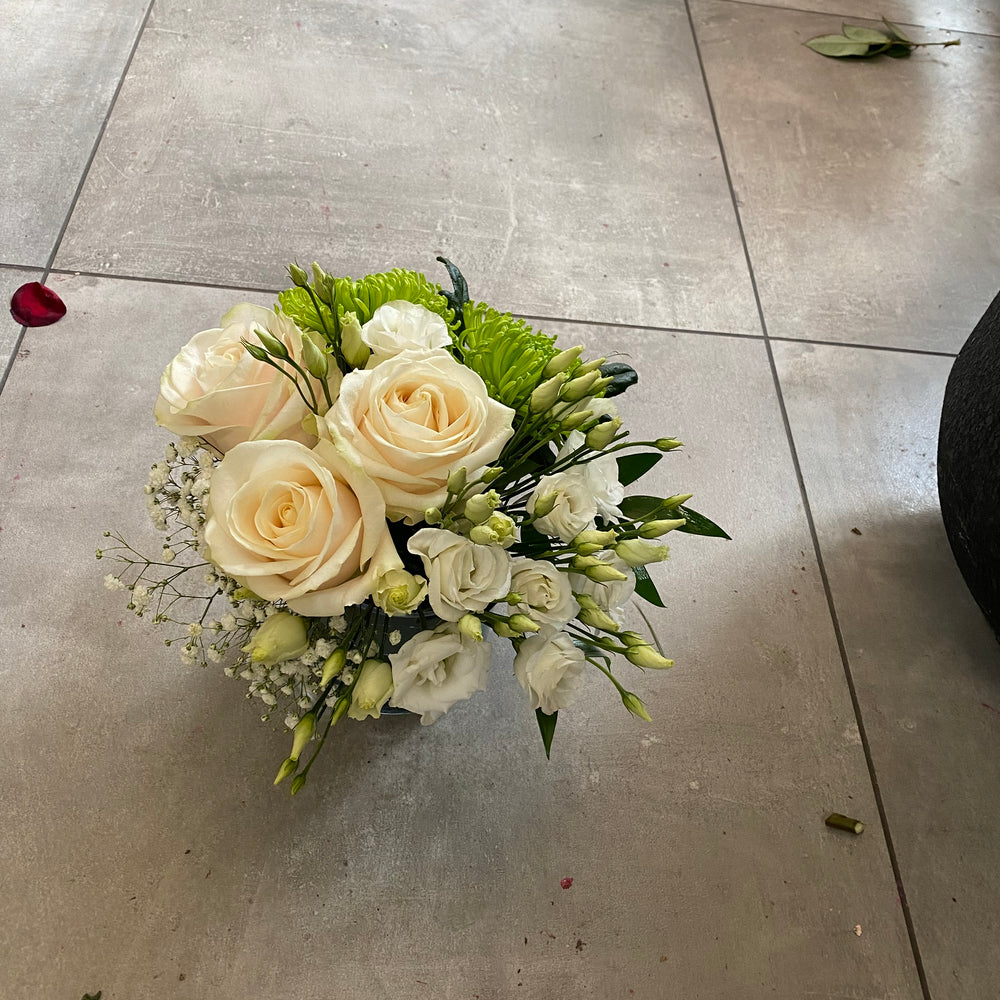 White and green arrangements in a vase