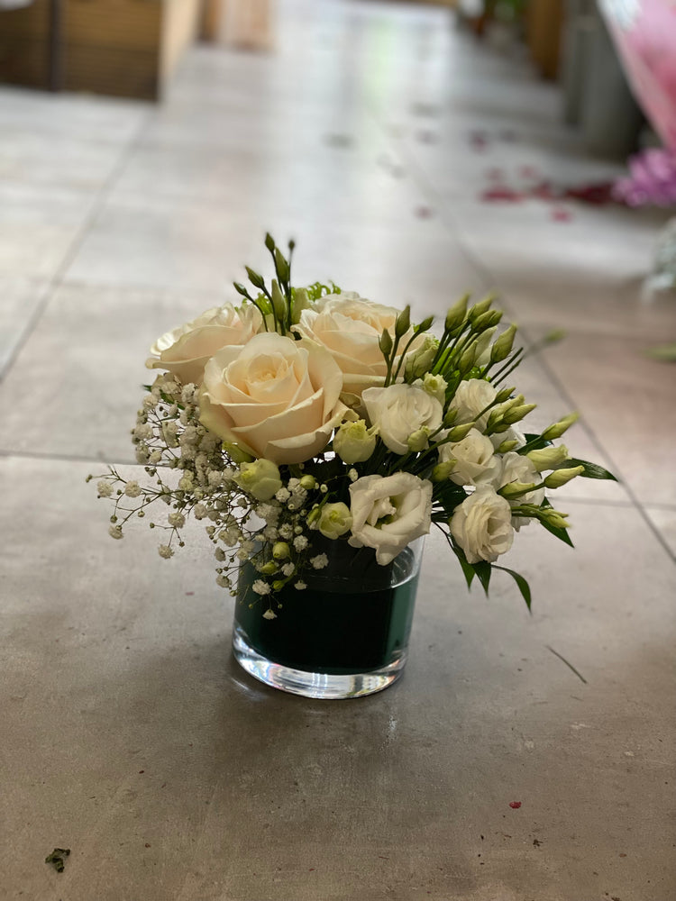 White and green arrangements in a vase